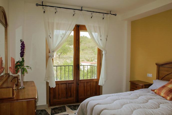 Imagen de la habitación del Hotel Alojamiento Rural El Tossal. Foto 4