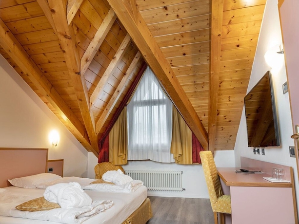 Imagen de la habitación del Hotel Alpholiday Dolomiti Wellness. Foto 11