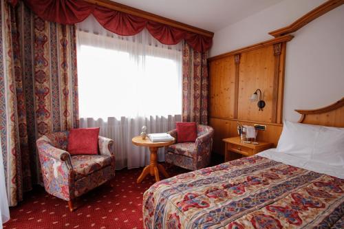 Imagen de la habitación del Hotel Alpi, Campitello di Fassa. Foto 11