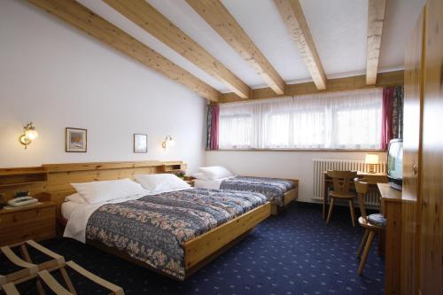 Imagen de la habitación del Hotel Alpi, Campitello di Fassa. Foto 16