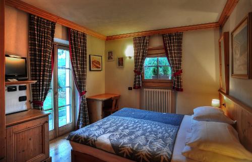 Imagen de la habitación del Hotel Alpi & Golf. Foto 5