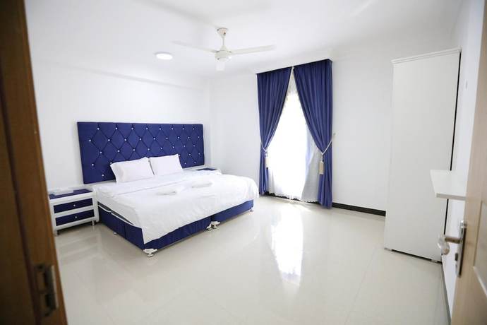 Imagen de la habitación del Hotel Alrayyan Apartments. Foto 3
