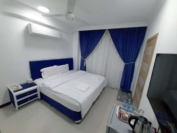Imagen de la habitación del Hotel Alrayyan Apartments. Foto 4