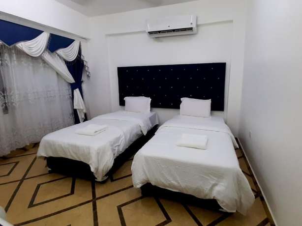 Imagen de la habitación del Hotel Alrayyan Apartments. Foto 5