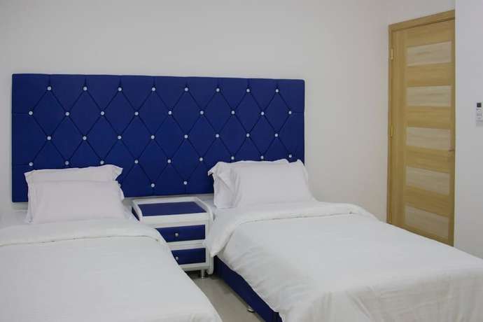 Imagen de la habitación del Hotel Alrayyan Apartments. Foto 10