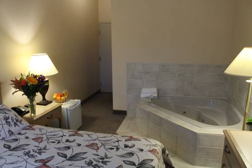 Imagen de la habitación del Hotel Altissimo Boutic Rigaud. Foto 10