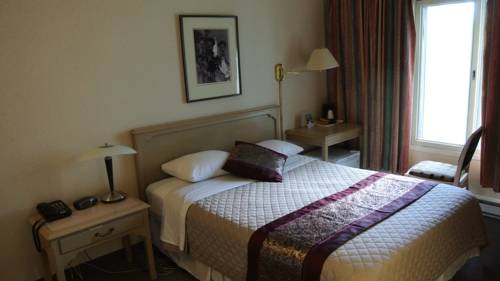 Imagen de la habitación del Hotel Altissimo Boutic Rigaud. Foto 14