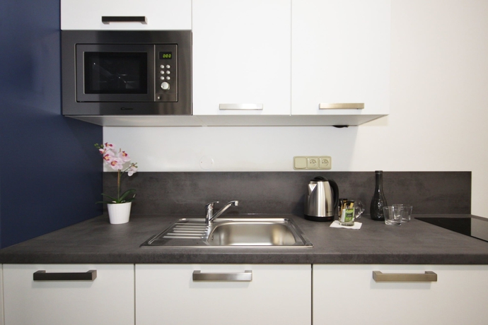 Imagen de la habitación del Hotel Alveo Suites. Foto 4