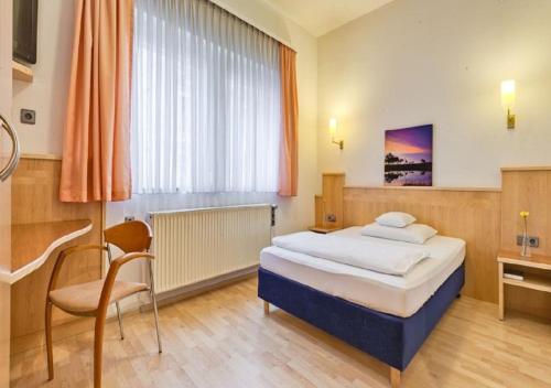 Imagen de la habitación del Hotel Am Friedensplatz. Foto 4