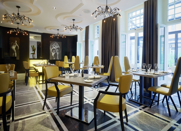 Imagen del bar/restaurante del Hotel Am Steinplatz Autograph Collection. Foto 3