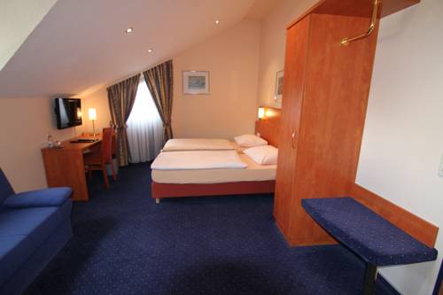 Imagen de la habitación del Hotel Am Tiergarten. Foto 10