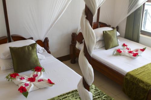 Imagen de la habitación del Hotel Amaan Beach Bungalows. Foto 9