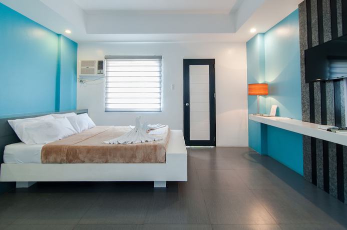 Imagen de la habitación del Hotel Amable Suites Hotel. Foto 7
