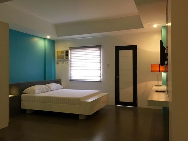 Imagen de la habitación del Hotel Amable Suites Hotel. Foto 11