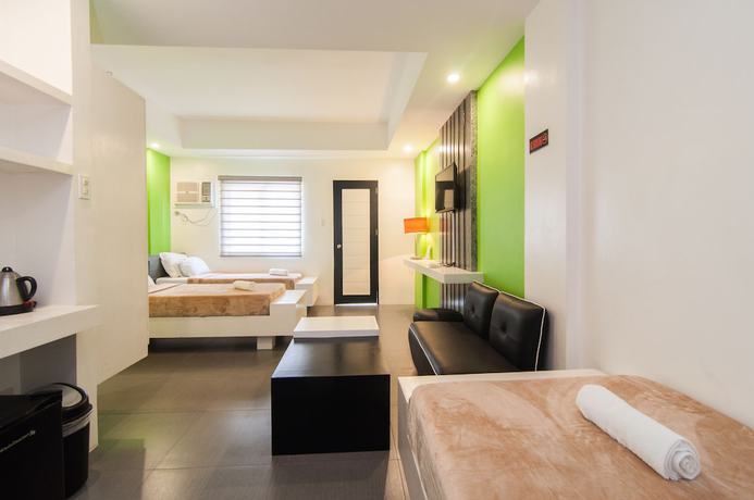 Imagen de la habitación del Hotel Amable Suites Hotel. Foto 15