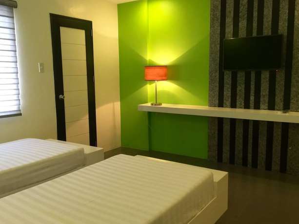 Imagen de la habitación del Hotel Amable Suites Hotel. Foto 17