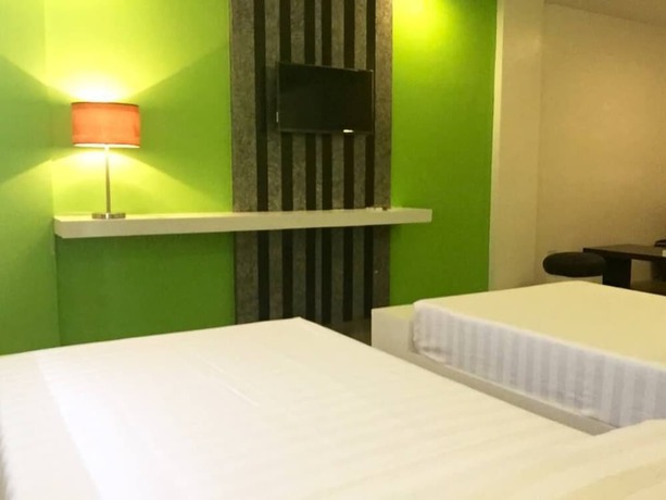 Imagen de la habitación del Hotel Amable Suites Hotel. Foto 18