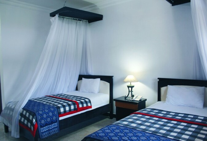 Imagen de la habitación del Hotel Aman Gati Hotel Lakey. Foto 12