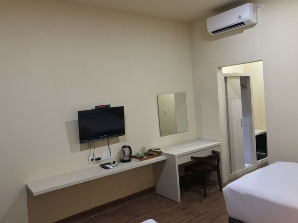 Imagen de la habitación del Hotel Aman Gati Hotel Lakey. Foto 13