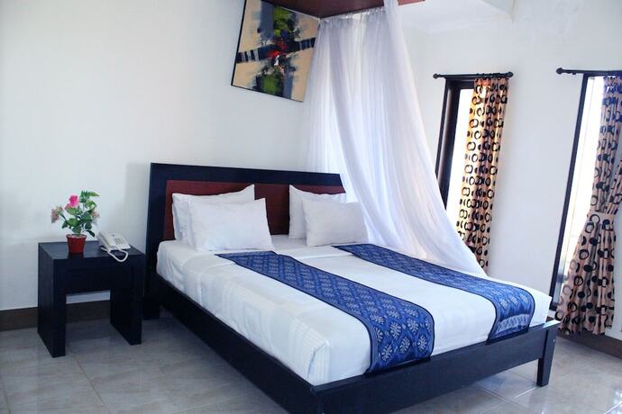 Imagen de la habitación del Hotel Aman Gati Hotel Lakey. Foto 16