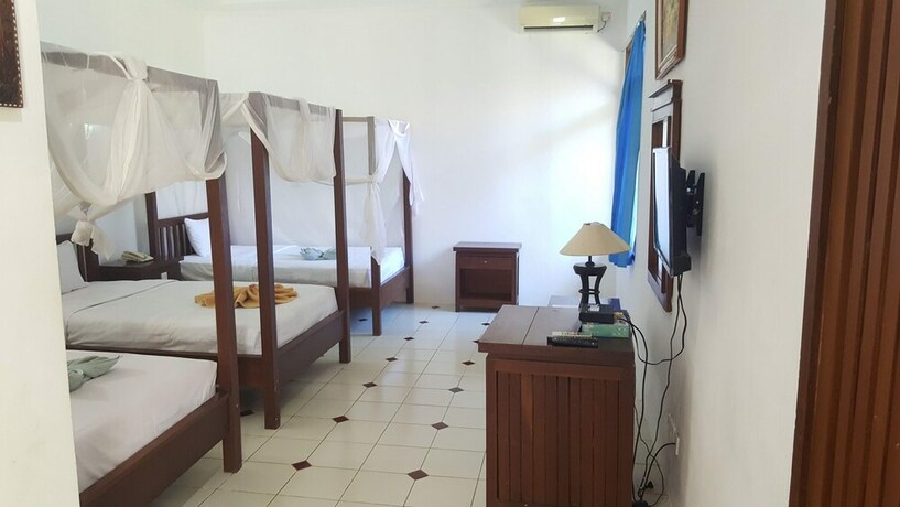 Imagen de la habitación del Hotel Aman Gati Hotel Lakey. Foto 17