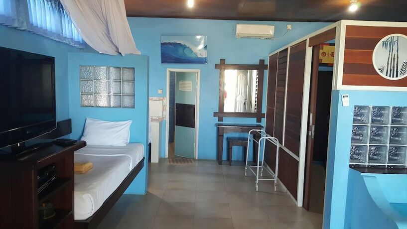 Imagen de la habitación del Hotel Aman Gati Hotel Lakey. Foto 18