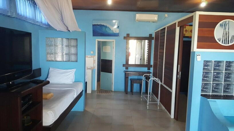 Imagen de la habitación del Hotel Aman Gati Hotel Lakey. Foto 22