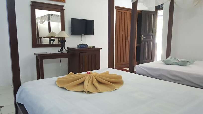 Imagen de la habitación del Hotel Aman Gati Hotel Lakey. Foto 28