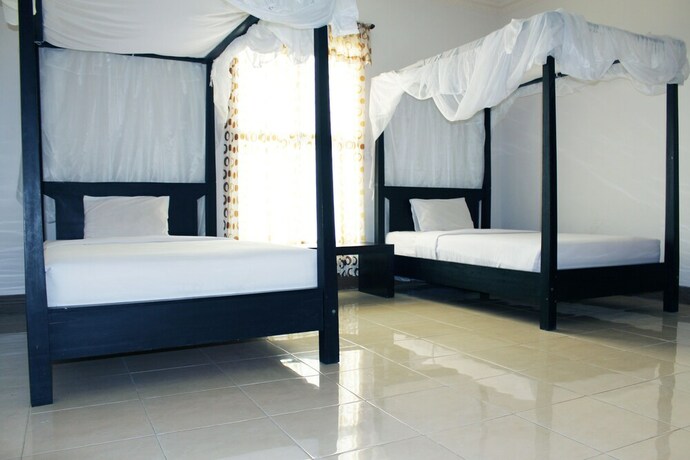 Imagen de la habitación del Hotel Aman Gati Hotel Lakey. Foto 31