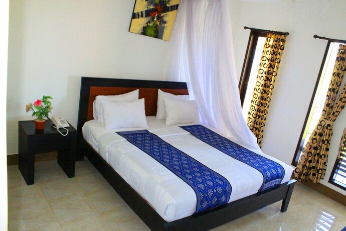 Imagen de la habitación del Hotel Aman Gati Hotel Lakey. Foto 34