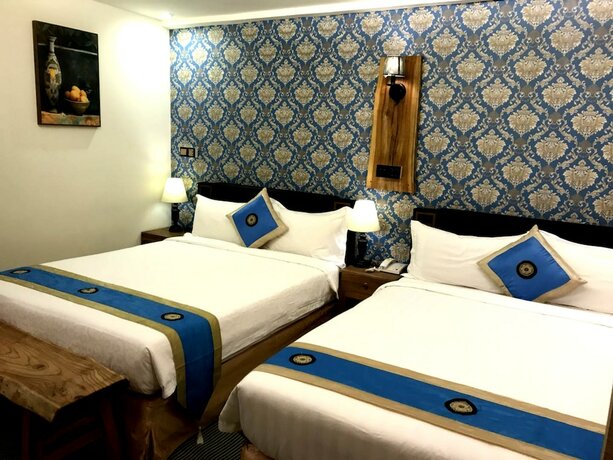 Imagen de la habitación del Hotel Amando Inn. Foto 8