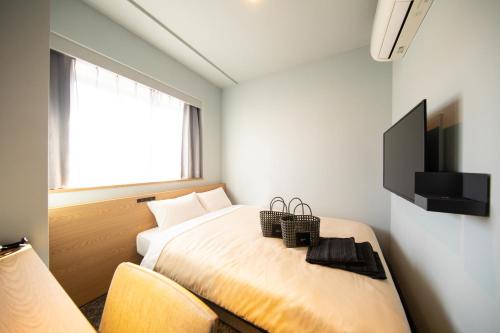 Imagen de la habitación del Hotel Amanek Inn Beppu. Foto 18