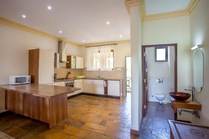 Imagen de la habitación del Hotel Amani Luxury Apartments Diani Beach. Foto 9