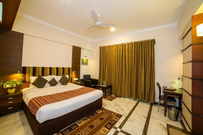 Imagen de la habitación del Hotel Amantra Comfort. Foto 24