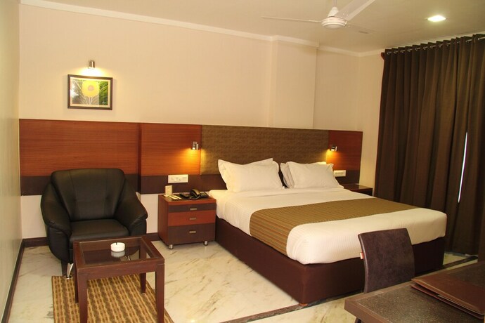 Imagen de la habitación del Hotel Amantra Comfort. Foto 27