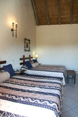 Imagen de la habitación del Hotel Amanzingwe Lodge Conference Centre and Spa. Foto 33