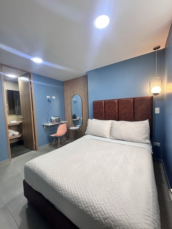 Imagen de la habitación del Hotel Amaranto Suites. Foto 8