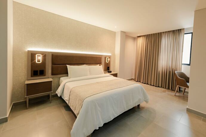 Imagen de la habitación del Hotel Amari Living Suites. Foto 16