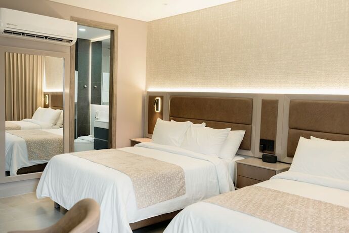 Imagen de la habitación del Hotel Amari Living Suites. Foto 18