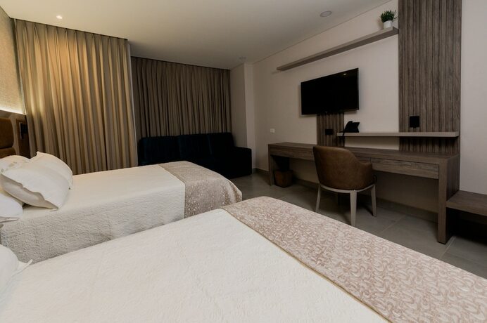 Imagen de la habitación del Hotel Amari Living Suites. Foto 19