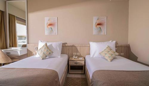 Imagen de la habitación del Hotel Amarina Abu Soma Resort & Aquapark. Foto 7