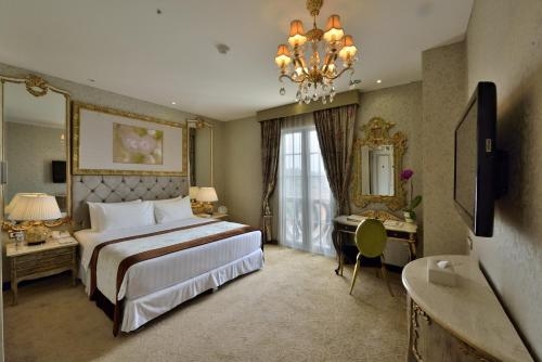 Imagen de la habitación del Hotel Amaroossa Royal. Foto 6