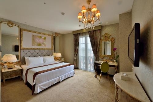 Imagen de la habitación del Hotel Amaroossa Royal. Foto 9