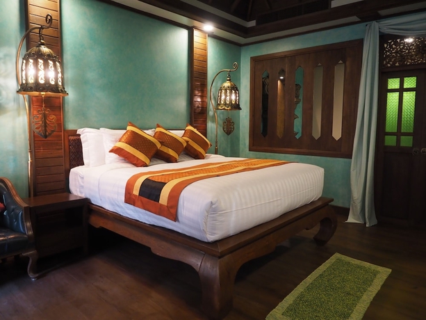 Imagen de la habitación del Hotel Amata Lanna Village. Foto 11