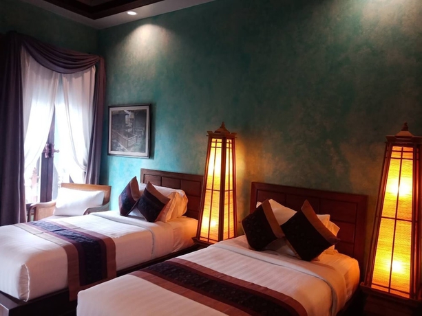 Imagen de la habitación del Hotel Amata Lanna Village. Foto 16