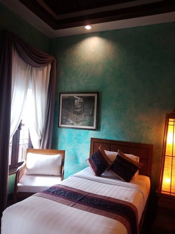 Imagen de la habitación del Hotel Amata Lanna Village. Foto 17