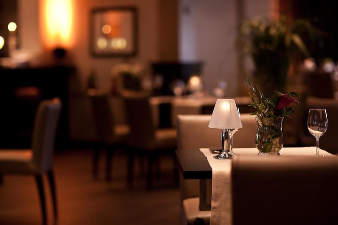 Imagen del bar/restaurante del Hotel Ambassador Bosten. Foto 4