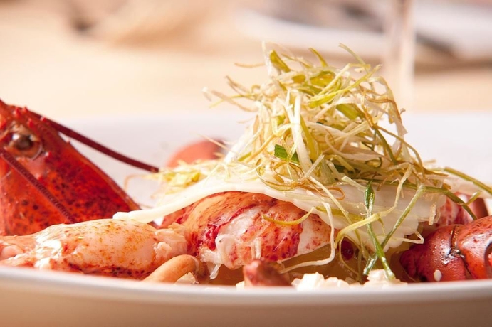 Imagen del bar/restaurante del Hotel Ambassador Bosten. Foto 8