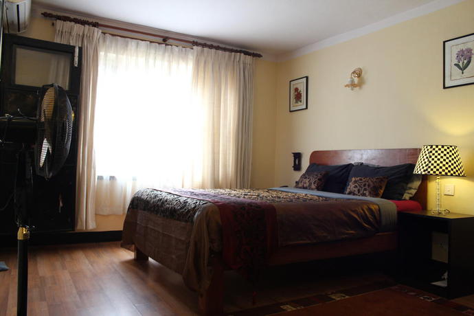 Imagen de la habitación del Hotel Ambassador Garden Home. Foto 4