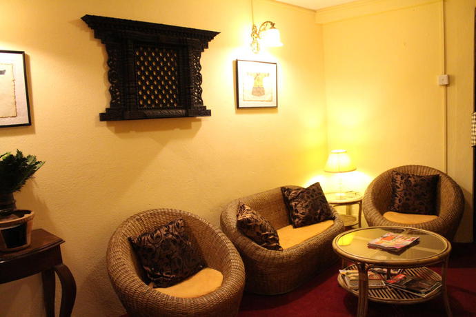 Imagen de la habitación del Hotel Ambassador Garden Home. Foto 10